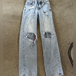 pacsun ripped light washed jeans 
some tears on the bottom of the jeans
